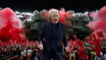 Ao fundo, festa da torcida do Flamengo e a frente o treinador Jorge Jesus